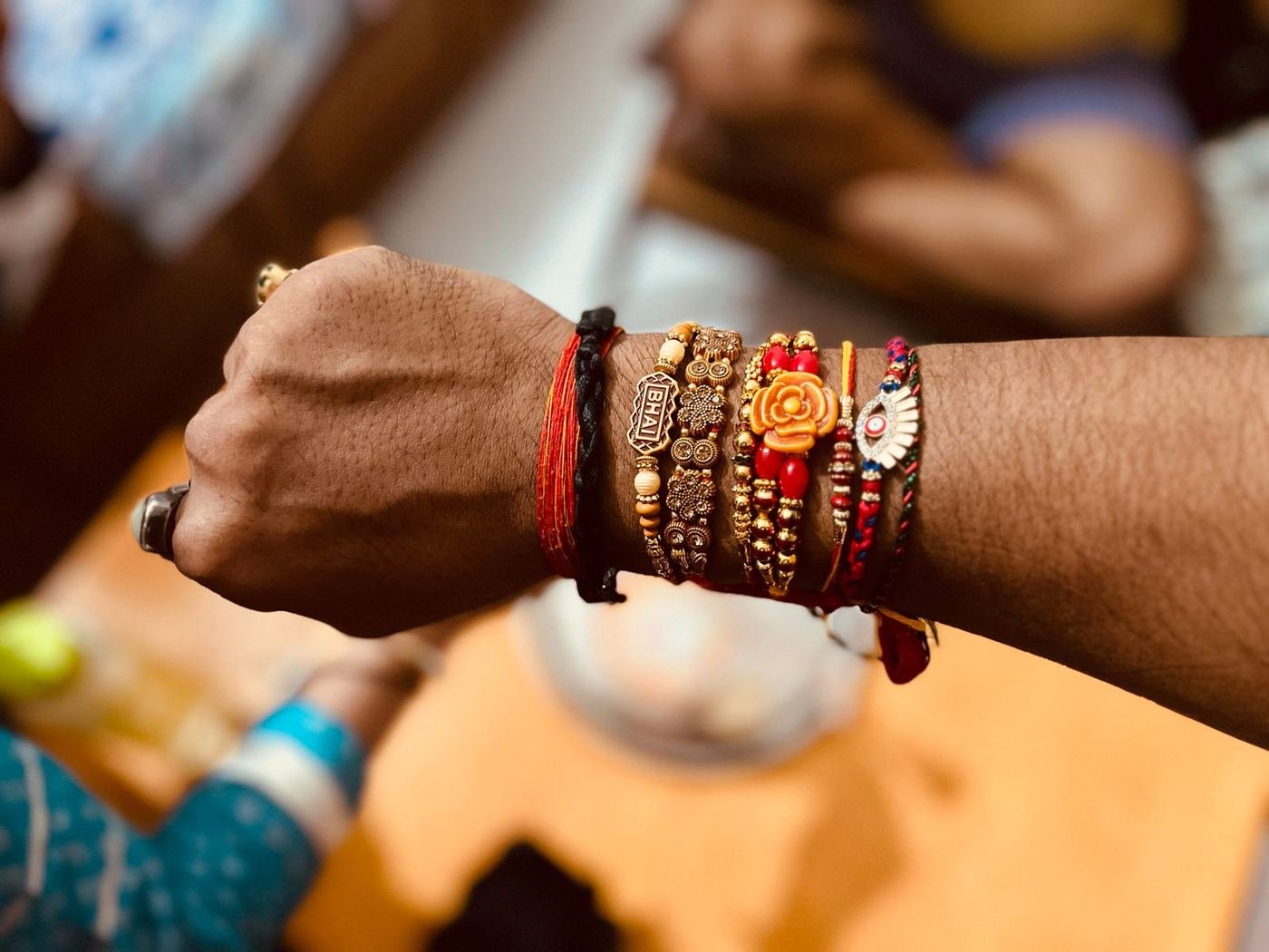 Rakhi threads tied on a wrist during Raksha Bandhan